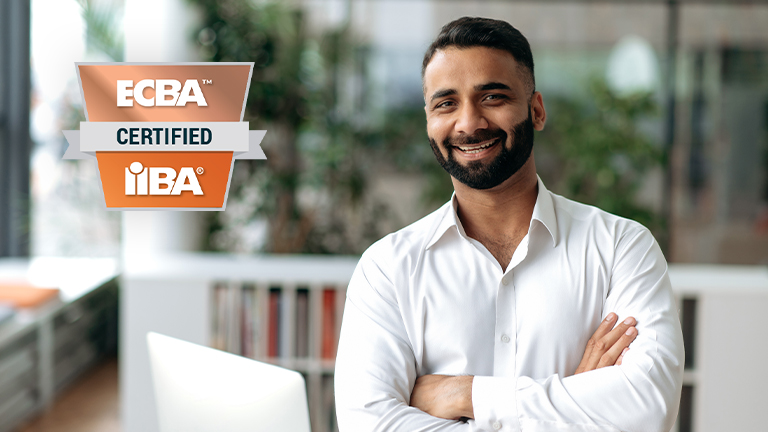 Man standing smiling with his arms crossed next to the ECBA badge